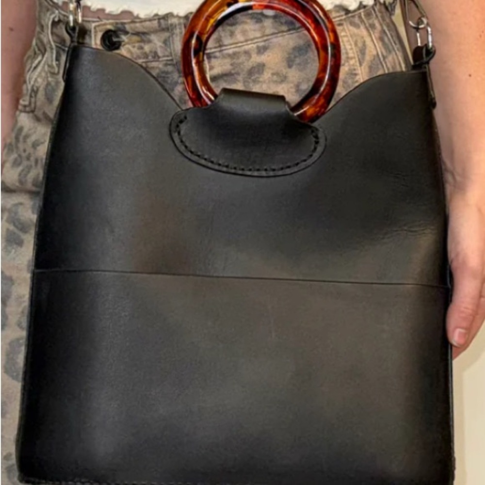 Sleek Black Shoulder Bag with Tortoise Shell Accent